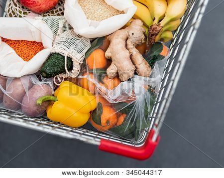 Fruit, Vegetables And Grains In Reusable Textile Fabric Bags Pouch In Shopping Cart. Top View Or Fla