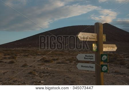 Trekking Post In Playa De La Tejitas, Tejitas Beach, El Medano, Tenerife, Canarias. With Blue Sky An