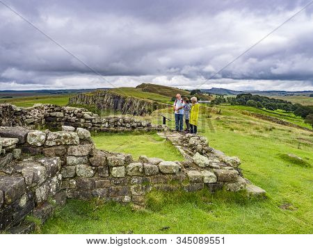 13 August 2018: Hadrians Wall, Northumberland - Group Of Walkers At Turret 45a On Hadrians Wall Near