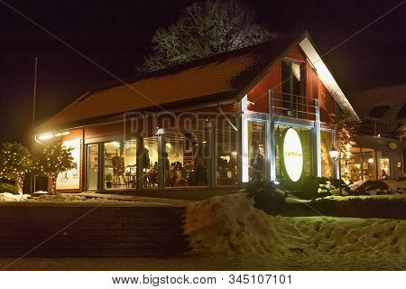 Trakai, Lithuania - December 26, 2018: Night View Of The Wooden Building Of The Restaurant Bona At W