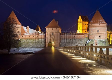 Beautiful Night View Of The Trakai Castle In Lithuania, On An Island In Lake Galve. Castle Construct