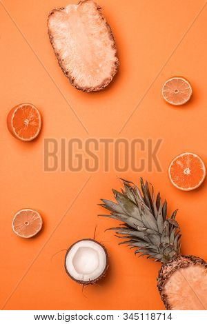 Minimal Tinted Composition With Exotic Fruits On An Orange Background. Summer Concept