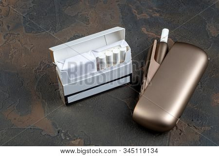 New Heat-not-burn Tobacco Heating System On Dark Background