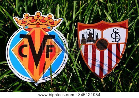 September 6, 2019, Madrid, Spain. Emblems Of Spanish Football Clubs Villarreal And Sevilla On The Gr