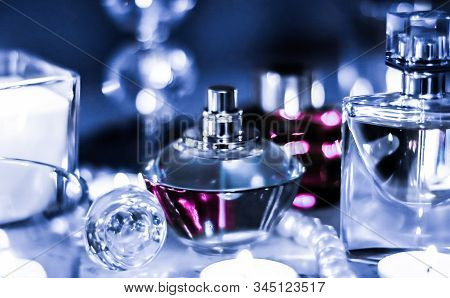 Perfume Bottle And Vintage Fragrance On Glamour Vanity Table At Night, Pearls Jewellery And Eau De P