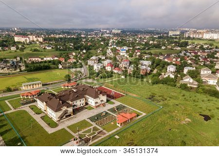 Aerial View Of New Prescool Building In Residential Rural Area.