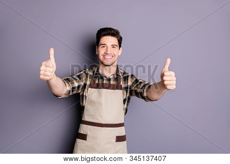 Photo Of Cheerful Fun Positive Handsome Man Smilt Toothy Showing Thumbs Up To Emphasize Quality Isol