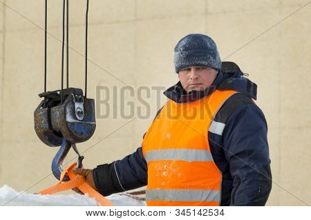Portrait Of Installer At Unloading Ice Blocks