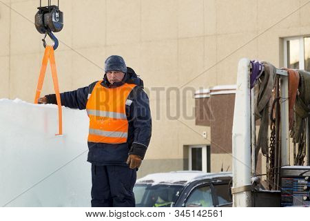 Portrait Of Installer At Unloading Ice Blocks