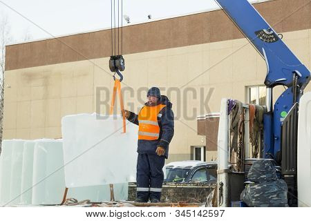 Portrait Of Installer At Unloading Ice Blocks