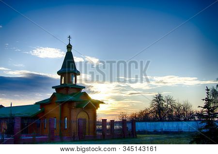 Orthodox Wooden Church At Dawn. Temple Of The Blessed Matrona Of Moscow Soligorsk