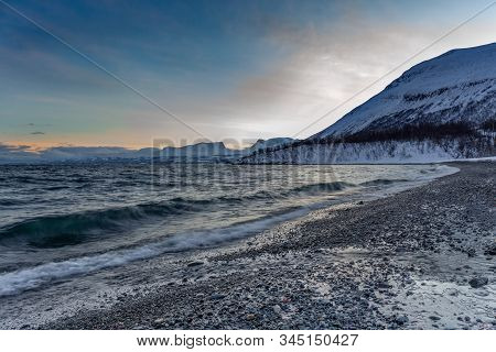 Beautiful View Over Beach And Fjord. Tornetrask, Sweden. Winter. Polar Night. Long Shutter Speed