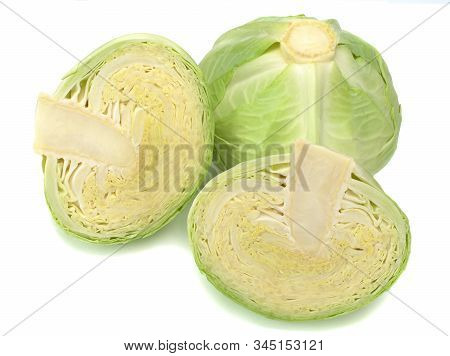 One Cabbage And Two It Halfs Isolated On White Background