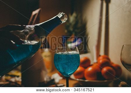 Blue Wine Is Poured Into A Glass