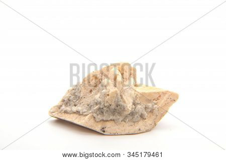 Calcite Rock Isolated On White Background, Calcite Is A Carbonate Mineral And The Most Stable Polymo