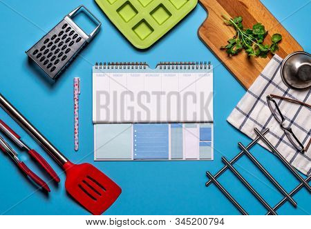 Healthy Workspace With Organizer And Kitchen Utensils On Blue Backcground