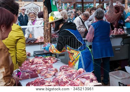 Russia, Khabarovsk, September 8, 2018: Harvest Festival, Meat Sales Behind The Shelves