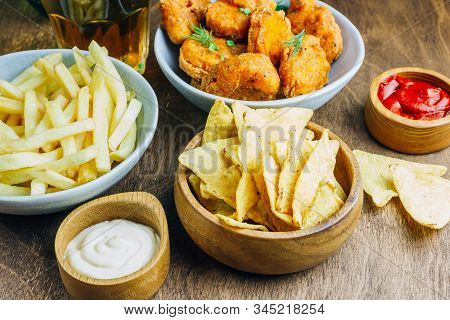 Table Fof Tasty Snacks And Beer Prepared For Watching Sports On Tv. Selective Focus