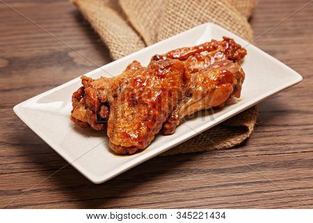 Chicken Wings With Burlap  On A Wooden Background With Shallow Dof