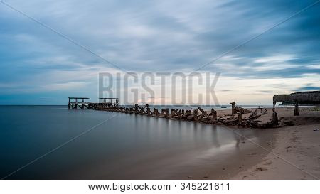 Dilapidated Old Fishing Dock Collapsing Into The Sea In Pak Nam Pran On The Gulf Of Thailand In Thai