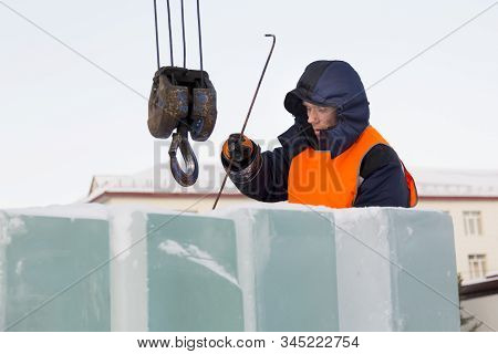 Portrait Of Installer At Unloading Ice Blocks