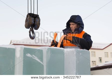 Portrait Of Installer At Unloading Ice Blocks