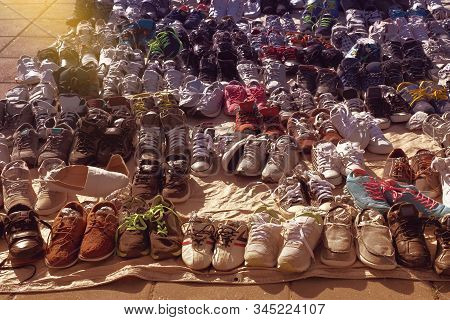 Many Used Shoes On The Floor For Sale At Secondhand Market