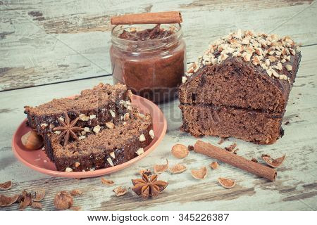 Vintage Photo, Fresh Gingerbread Or Dark Cake With Cocoa, Chocolate And Plum Jam On Old Rustic Board