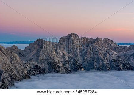 Spectacular Morning Mountain Panorama With Mists Covering A Valley.