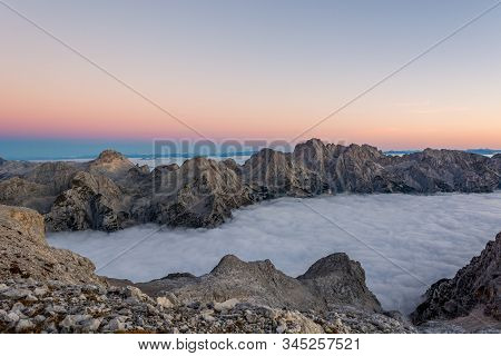 Spectacular Morning Mountain Panorama With Mists Covering A Valley.