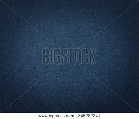 Dark Blue Paper Texture Or Background. Blue Cardboard With Dark Vignette.