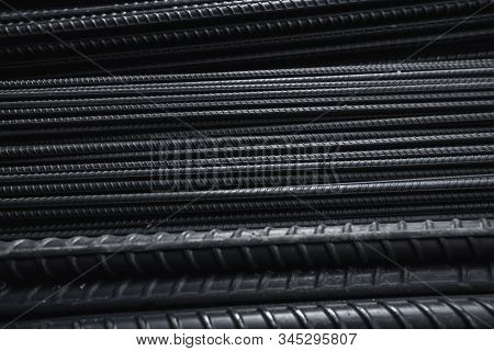 Building Armature In The Warehouse Of Metallurgical Products Or On Construction Site. Stack Of Heavy