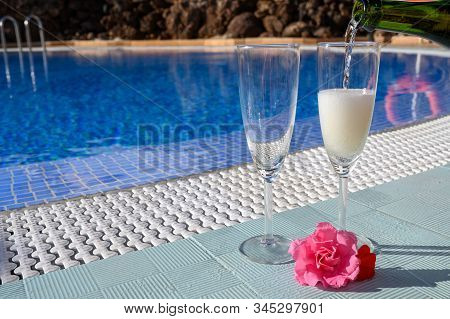 Pool Party With Two Glasses Of Bubbles White Champagne Or Cava Wine, Romantic Event On All Inclusive