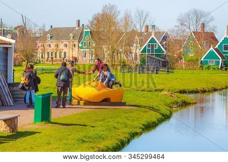 Zaanse Schans, Netherlands - April 1, 2016: Large Yellow Wooden Shoes, Clogs Or Klompens For Taking 