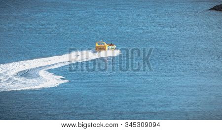 Jetboat For Tourists Entering The Harbor Of Albufeira, Portugal