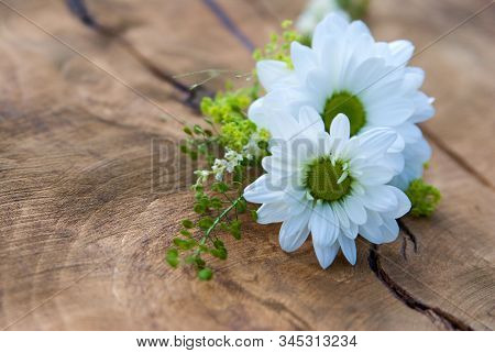 Couple Of White Chrisanthemum On The Wooden Board, Decoration For Wedding Guests