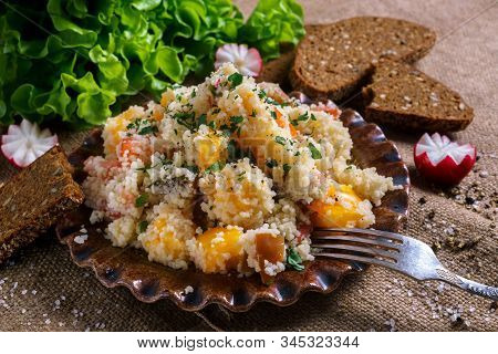 Homemade Fresh Couscous Salad With Tomatoes In Plate.