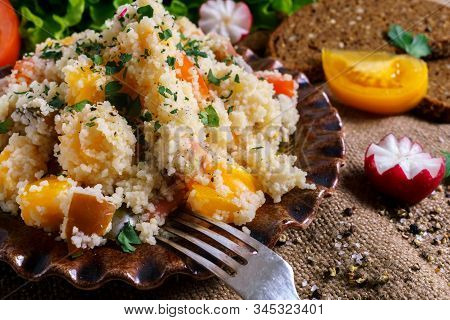 Homemade Fresh Couscous Salad With Tomatoes In Plate.