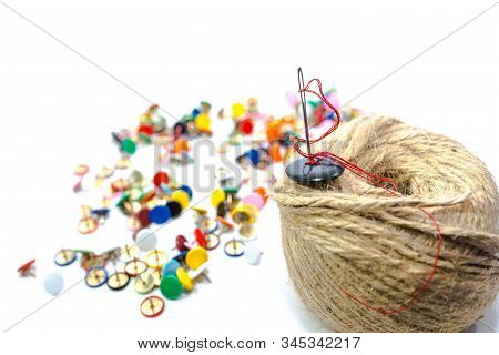 Needle Eye On Focuswith Red Thread,  Black Button On Hemp Rope Isolated On White Background, Colorfu