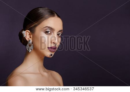 Profile Portrait Of A Girl With Splendid Makeup And Hair Arranged, Pose In The Studio In Profile Wit