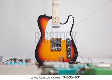 Electric Guitar And Effect Pedals In The Recording Studio. Concept Of Creating Guitar Music, Recordi