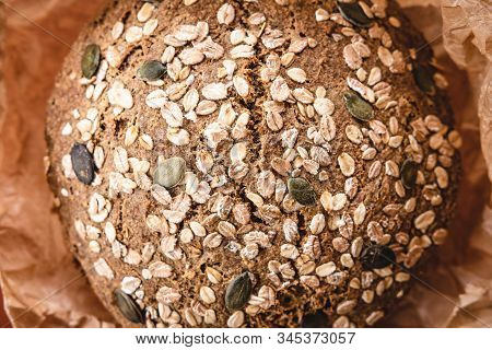 Whole Grain Traditional Rye Bread In Brown Parchment Paper