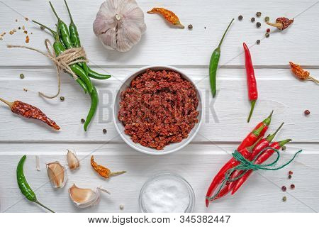 Spicy Chili On A Light Background, Flatlay. Used As An Ingredient For Harissa, Ajika, Muhammara. Red