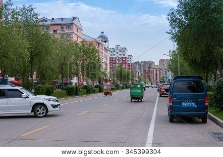 China, Heihe, July 2019: Road With Cars, Streets Of The Chinese City Of Heihe In The Summer