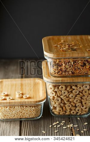 Breakfast Cereal. Glass Boxes With Granola, Cereal Rings And Quinoa Pops. Cereal Loops In A Bowl. He