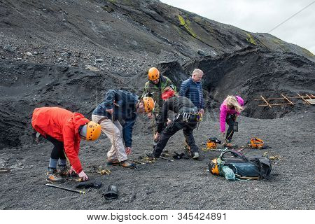 Tourists Hiking At Solheimajokull Glacier, Iceland