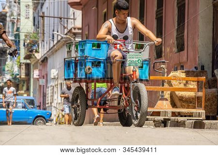 Havana, Cuba - May 16, 2019: Bicycle Taxi Driver In The Street Of Old Havana City During A Vibrant A