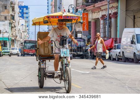 Havana, Cuba - May 16, 2019: Bicycle Taxi Driver In The Street Of Old Havana City During A Vibrant A