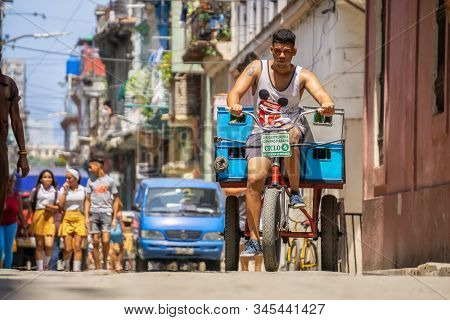Havana, Cuba - May 16, 2019: Bicycle Taxi Driver In The Street Of Old Havana City During A Vibrant A