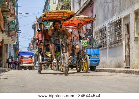 Havana, Cuba - May 16, 2019: Bicycle Taxi Driver In The Street Of Old Havana City During A Vibrant A
